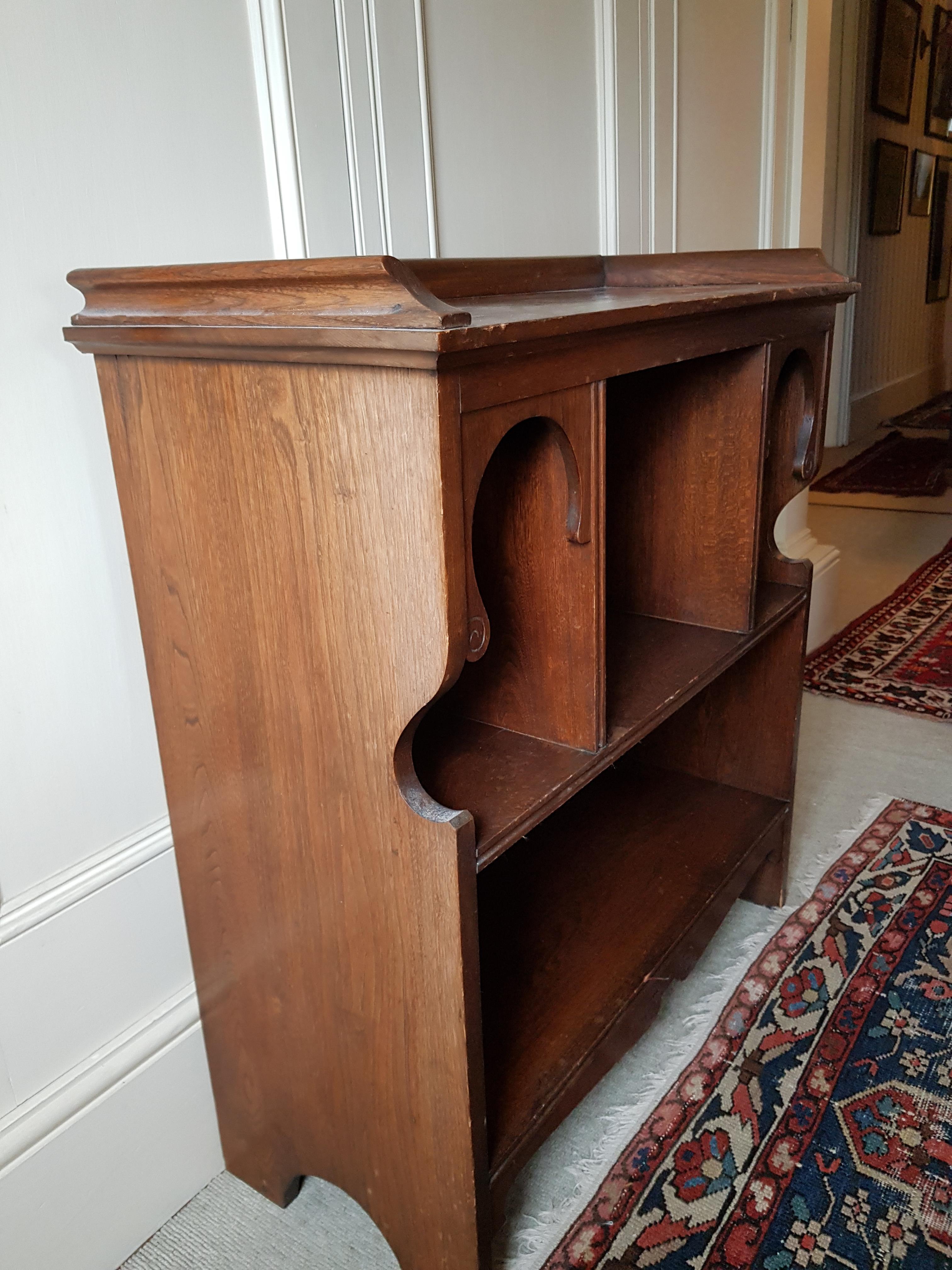 An early 20th century Moorish style Blackie & Son Limited oak open bookcase, width 77cm, depth 33cm, height 85cm